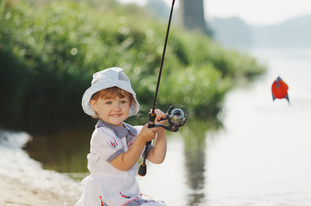 Happy girl with rod on coast of river containing fishing, girl, and little