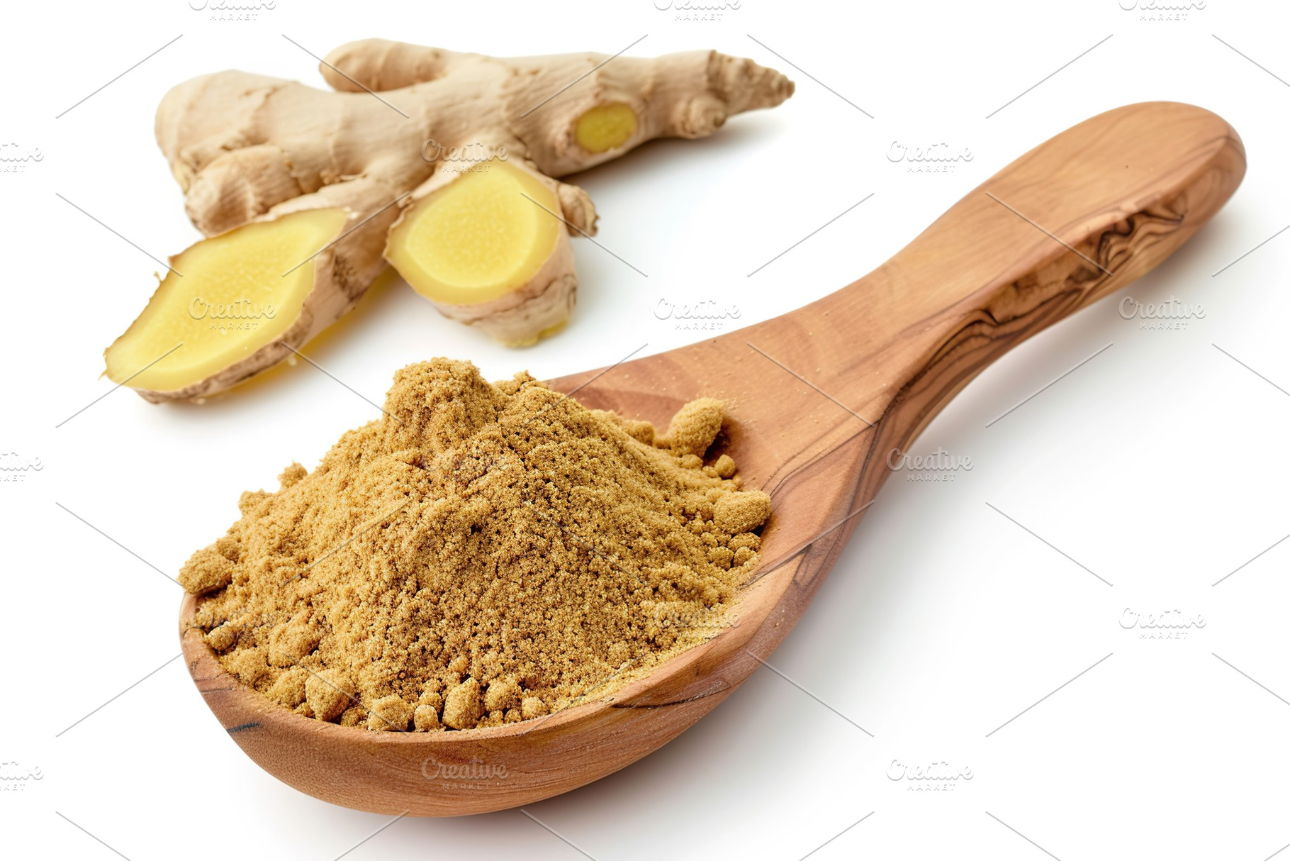 Ground dry ginger in wooden spoon isolated on white background, a Food & Drink Photo by AlyaAnd