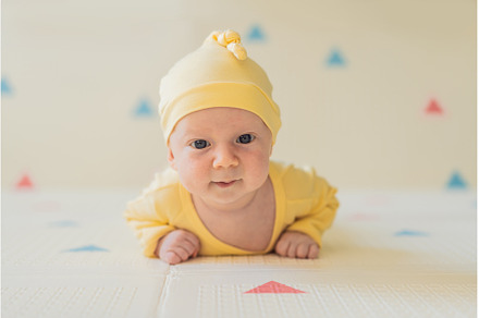 One-month-old baby lying on tummy, a Person Photo by Elizaveta Galitskaya