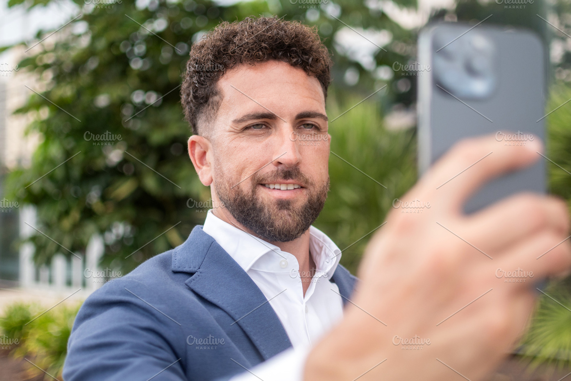 Businessman using smartphone for video call, a Business Photo by etorres69