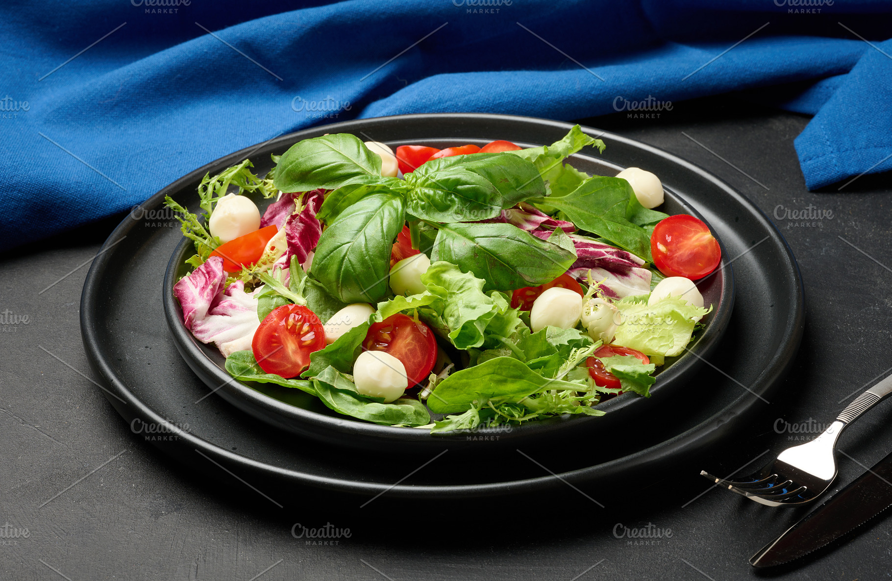 Fresh salad with mixed greens, radicchio and cherry tomatoes, se, a Food & Drink Photo by ndanko