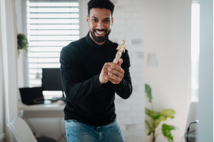 Happy man proudly holding a trophy., a Person Photo by HalfPoint