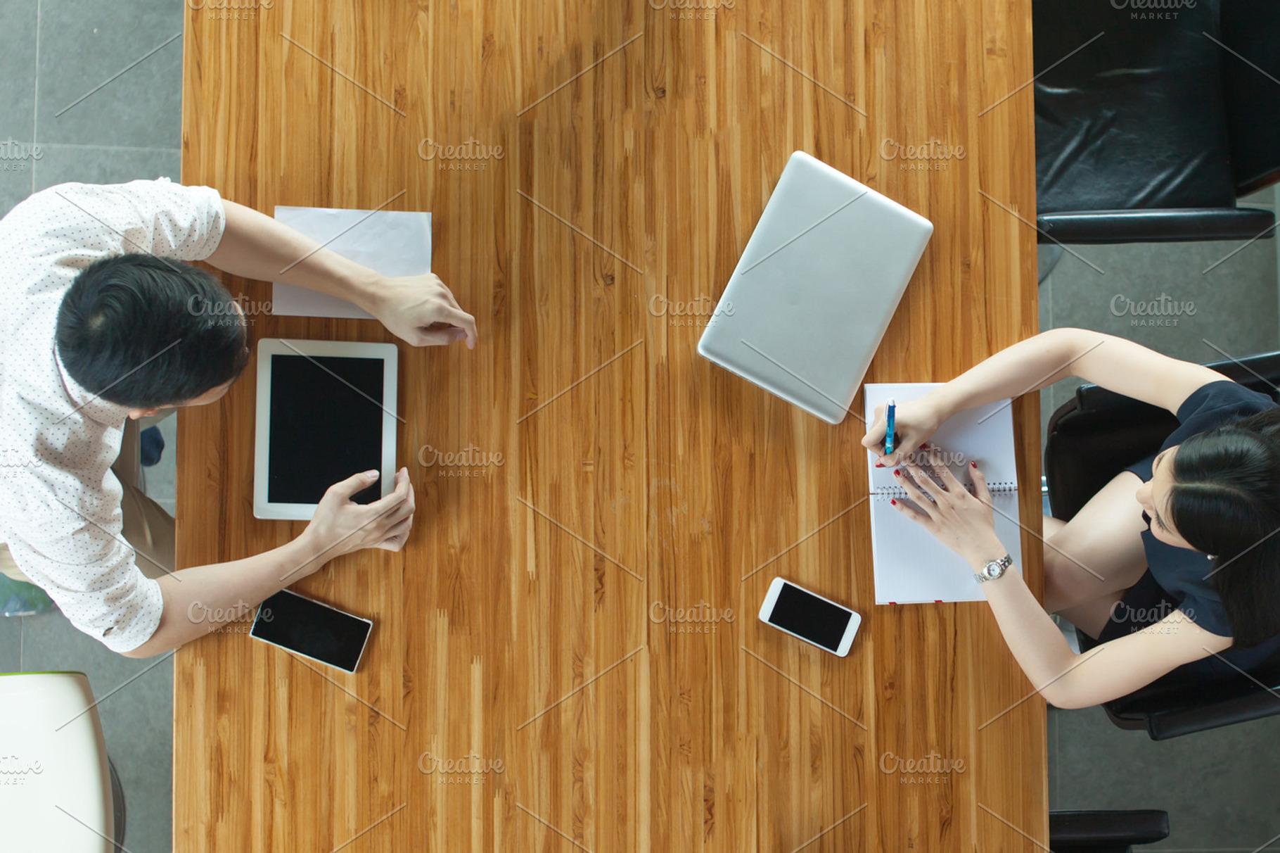 Top view of business or creative people discussing behind the desk featuring, a Business Photo by Twinster Photo