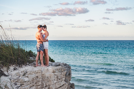 Handsome man and pretty woman stand against the backdrop of a rock, a Person Photo by Svetlana Barchan