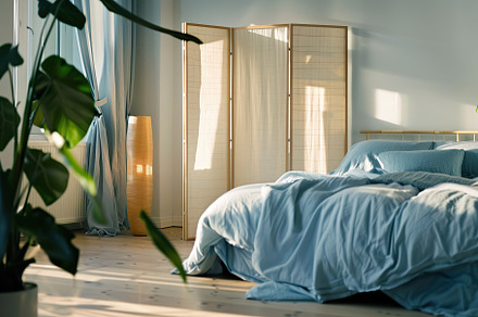 Stylish interior of modern bedroom with wooden folding screen, a Beauty & Fashion Photo by AlyaAnd