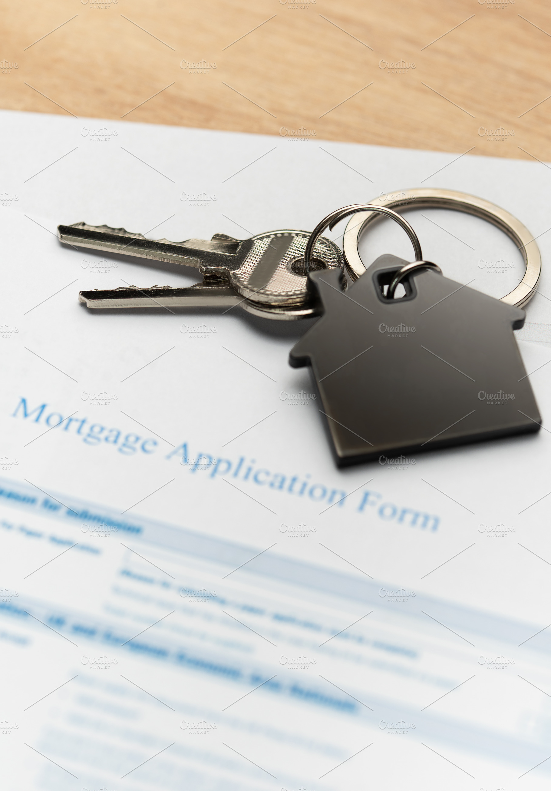 Mortgage application form with house keys for real estate loan, a Business Photo by Olena Rudo