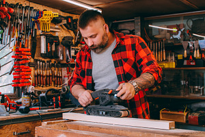 Woodworking process furniture making carpenter, a Person Photo by Photo Drive Studio
