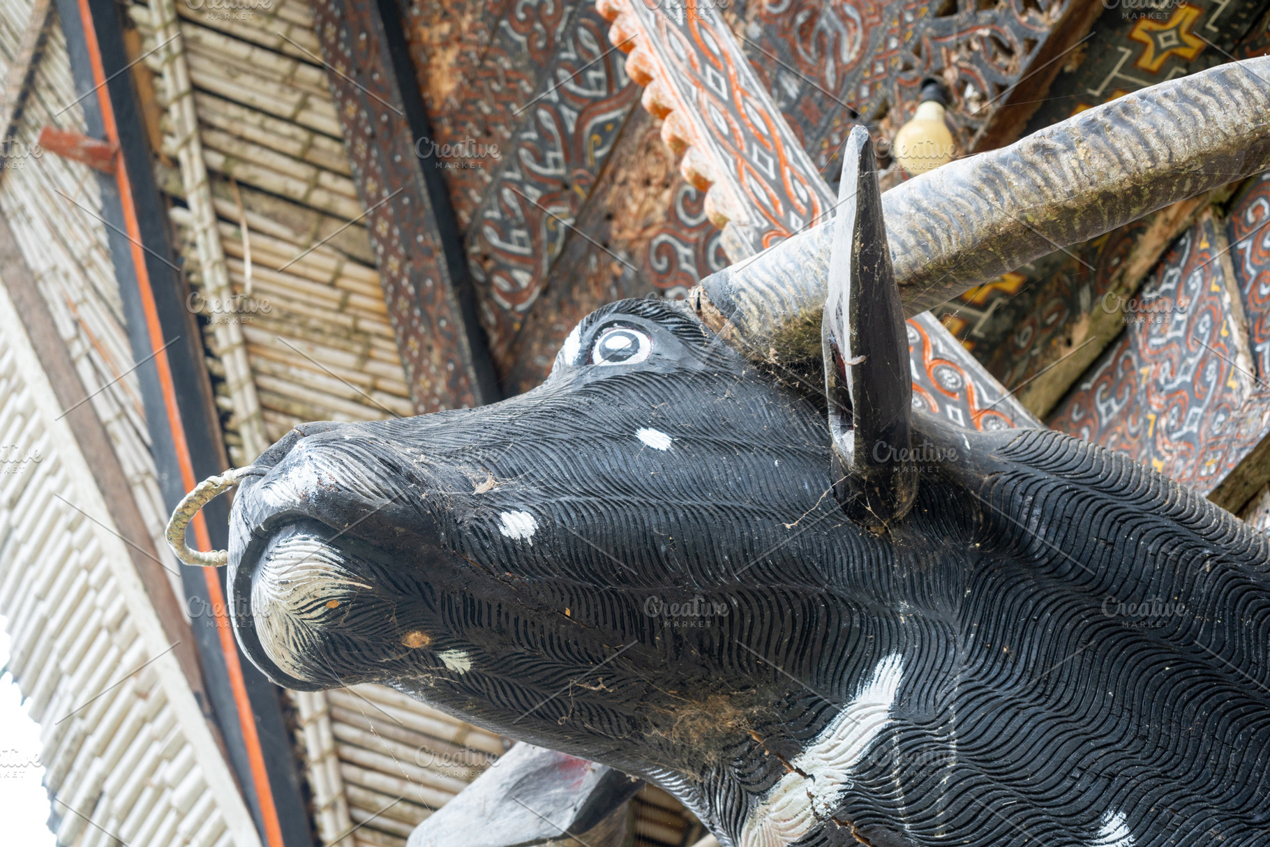 Carved buffalo head on Toraja house, Sulawesi, Indonesia, an Arts & Entertainment Photo by GoodGoods