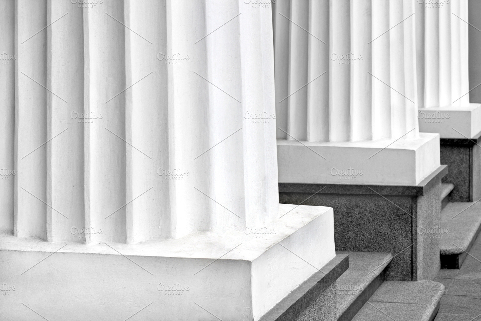 Detail of classical Greek columns, an Architecture Photo by BOOCYS
