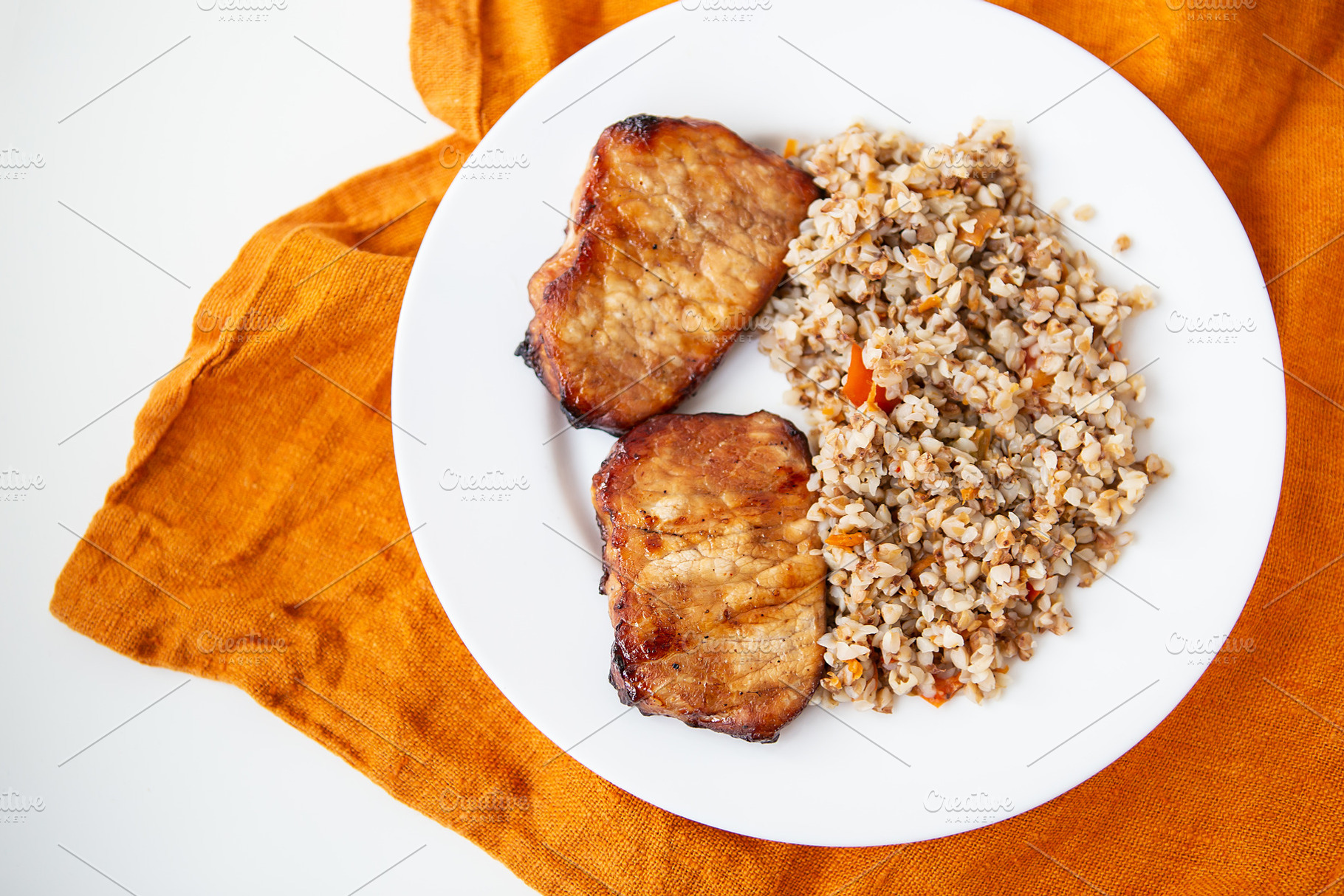 Delicious and appetizing pork tenderloin steak, grilled with buckwheat and vege, a Food & Drink Photo by Artsaba Family