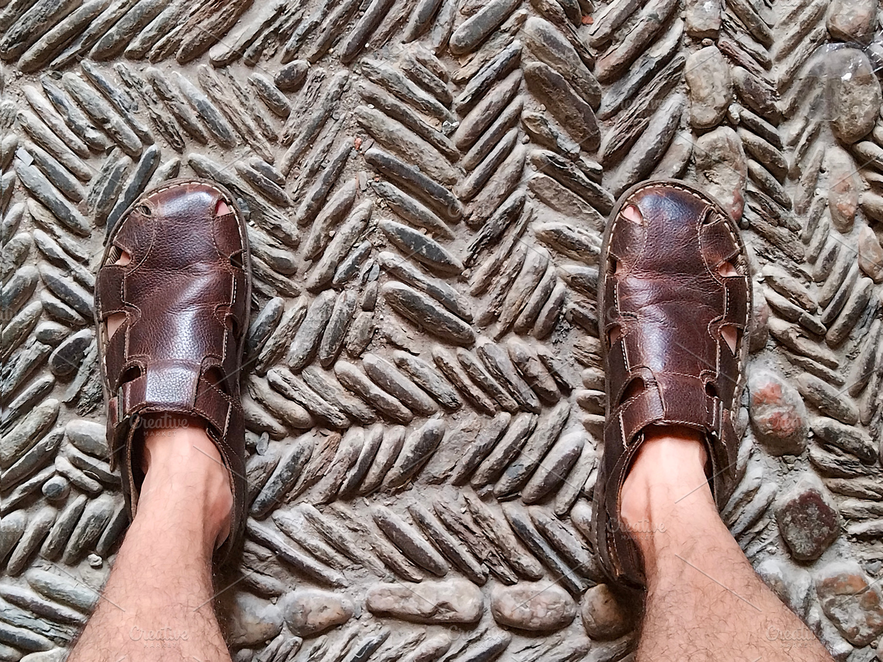 Feet on textured floor mat seen from above, a Person Photo by DanFLCreativo