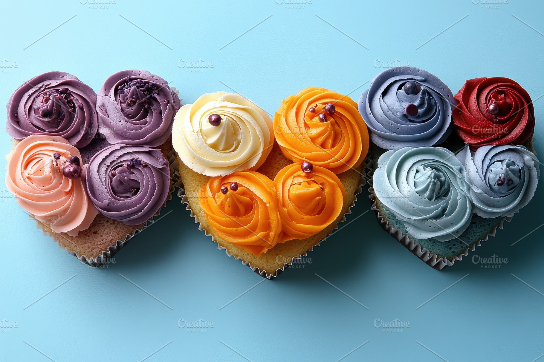 Colorful heart-shaped cupcakes with, a Photo by Tanuart