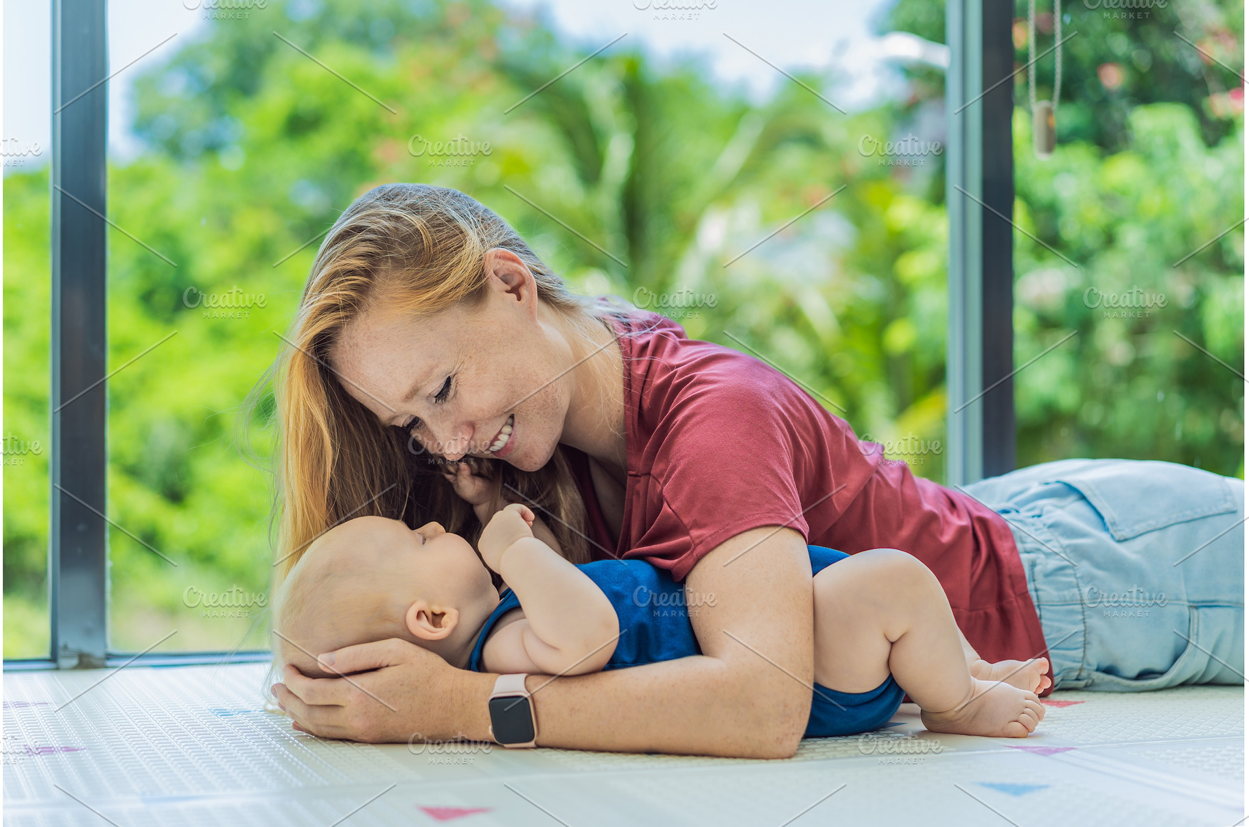 Mother and baby lying on a soft play, a Person Photo by Elizaveta Galitskaya