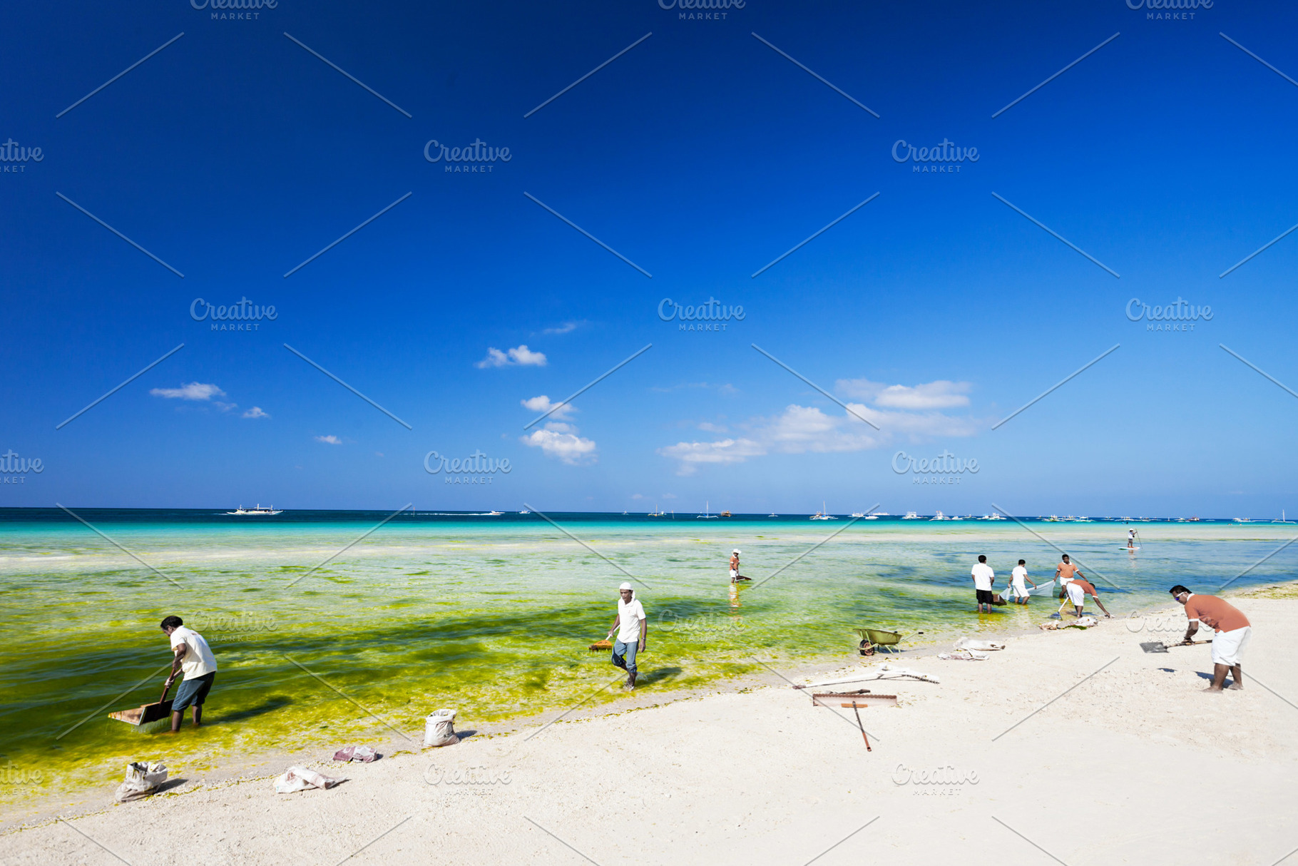 Cleaning the beach, a Photo by saiko3p