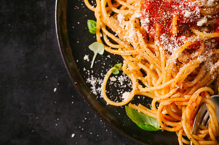 Dark plate with italian spaghetti containing spaghetti, italian, and pasta, a Food & Drink Photo by Valeria Art