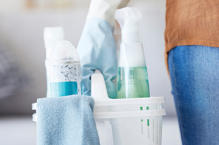Hands, cleaning detergent and spray bottle, container and cleaning service for bacteria, glove and product in home. Cleaner, basket and housekeeper working, service and chemical in house with woman, a Photo by Peopleimages.com