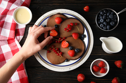 Concept of sweet food, chocolate pancakes, top view, a Food & Drink Photo by AtlasStudio PRO