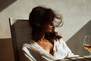 Sunlit moment with a glass of wine, a Photo by Beautiful things