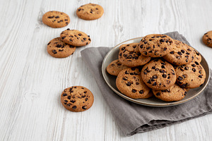 Homemade Chocolate Chip Cookies on a Plate, low angle view. Copy, a Food & Drink Photo by LiudmylaChuhunova