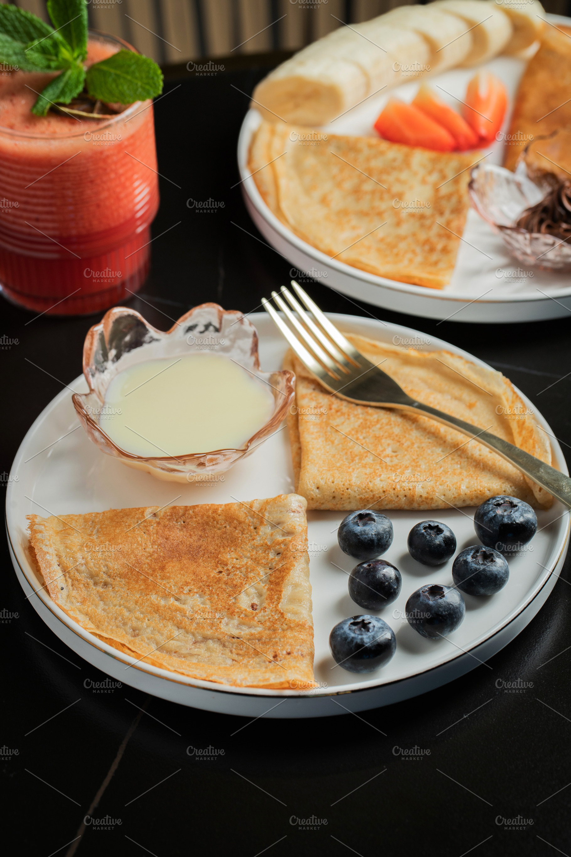 Pancakes with blueberry and honey on a white plate, a Food & Drink Photo by Budarinphoto