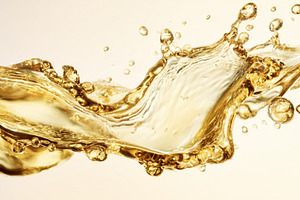 Golden liquid splashing wave creating dynamic motion and bubbles, a Photo by Studio ANNA