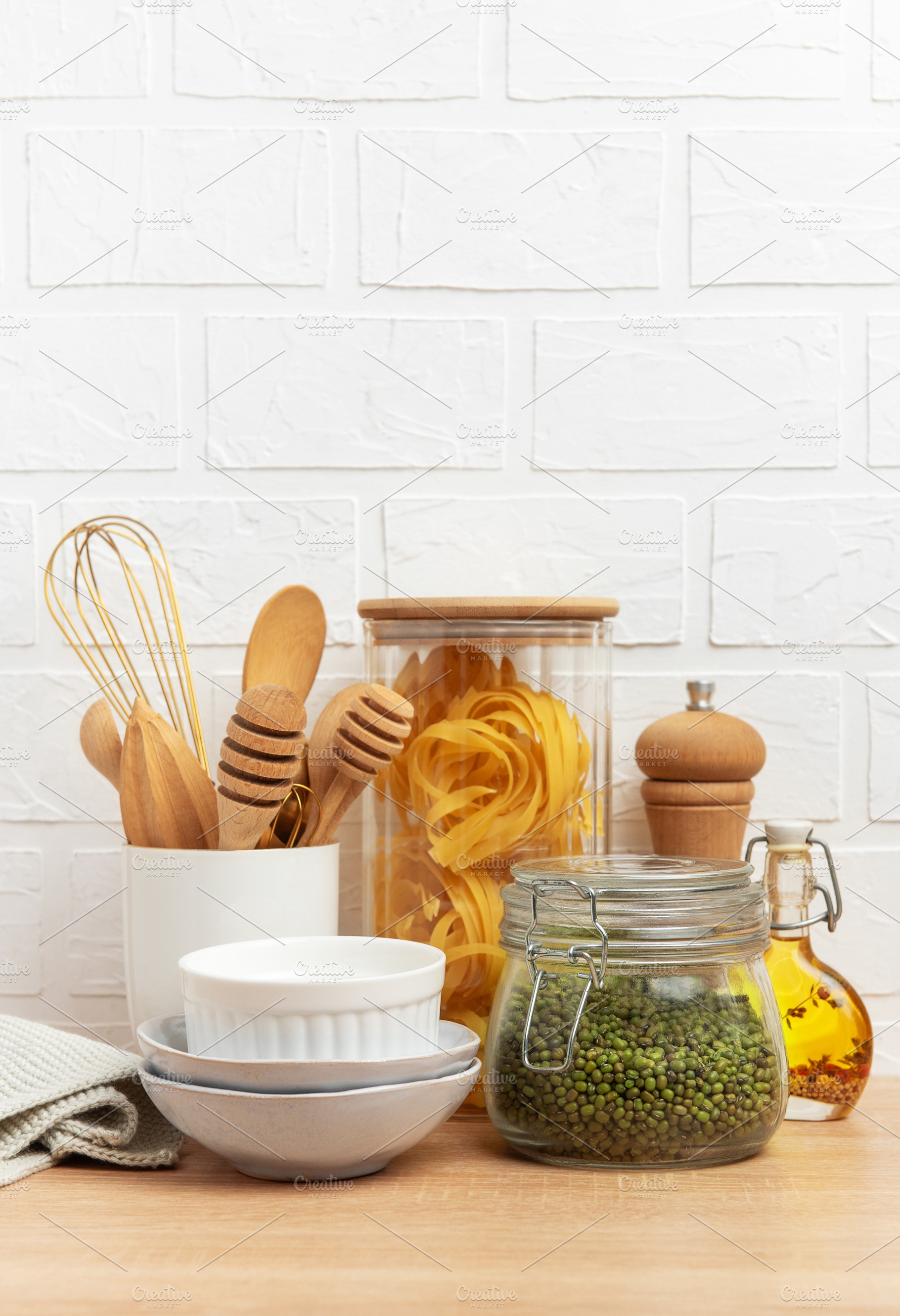 Kitchen utensils, pasta, mung beans and oil creating a cozy culi, a Food & Drink Photo by Olena Rudo
