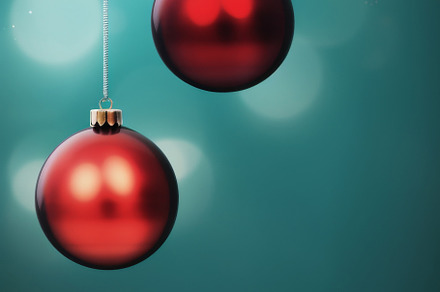 Christmas red and green matte ornaments on teal green background, a Photo by Dvoevnore photos