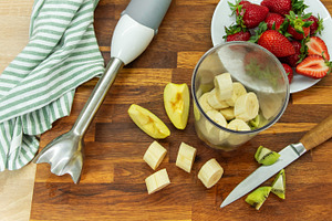Preparing fruit smoothie with banana strawberries and kiwi, a Food & Drink Photo by Olena Rudo