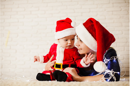 Mom with baby in santa claus costume, a Holiday Photo by oksix