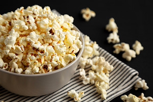 Homemade Butter Popcorn with Salt in a Bowl, side view., a Food & Drink Photo by LiudmylaChuhunova