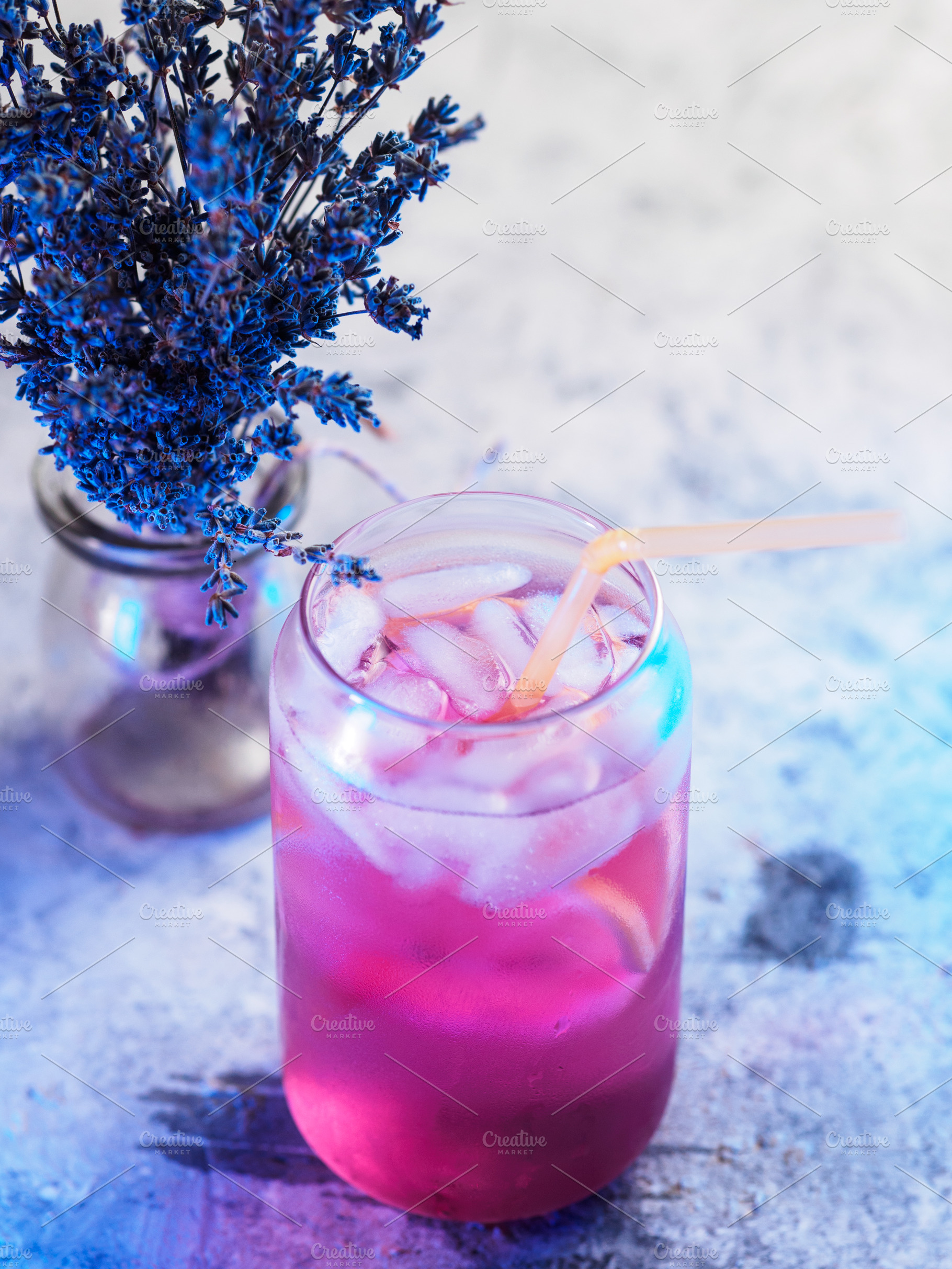 lavender drink with ice and lemon. stone background., a Food & Drink Photo by PavelKant