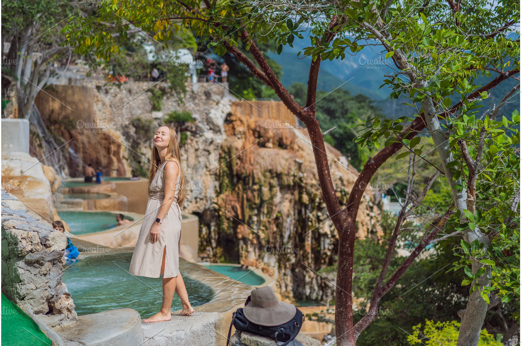 Female tourist exploring Grutas, a Holiday Photo by Elizaveta Galitskaya