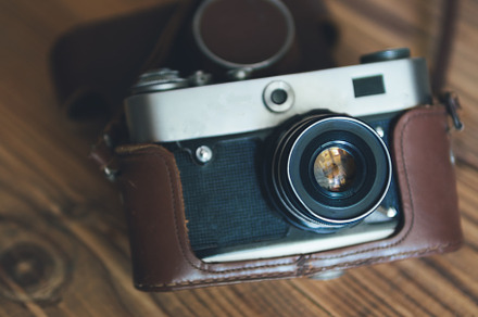 Vintage camera on wooden background containing vintage, camera, and retro, a Technology Photo by PavelKant