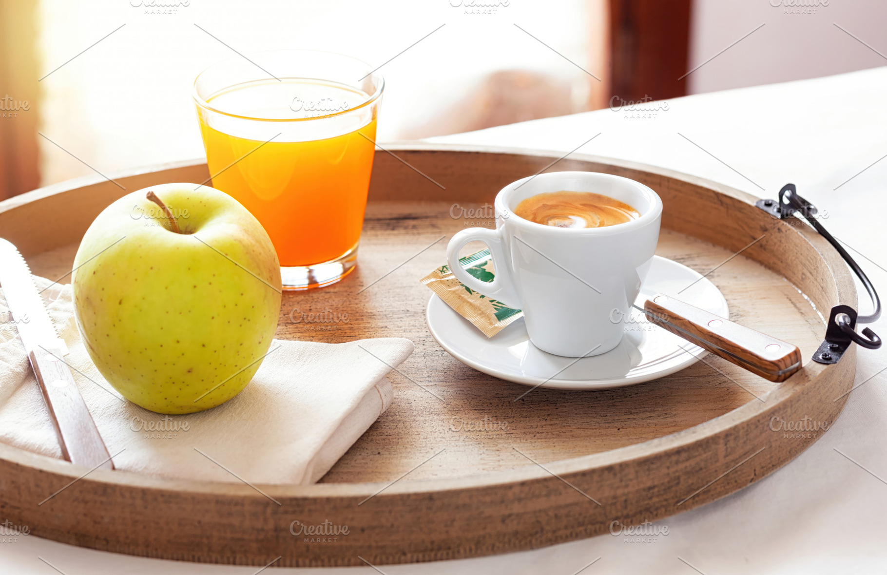 Delicious breakfast with coffee, juice and apple on wooden tray, a Food & Drink Photo by Antonio Gravante Market