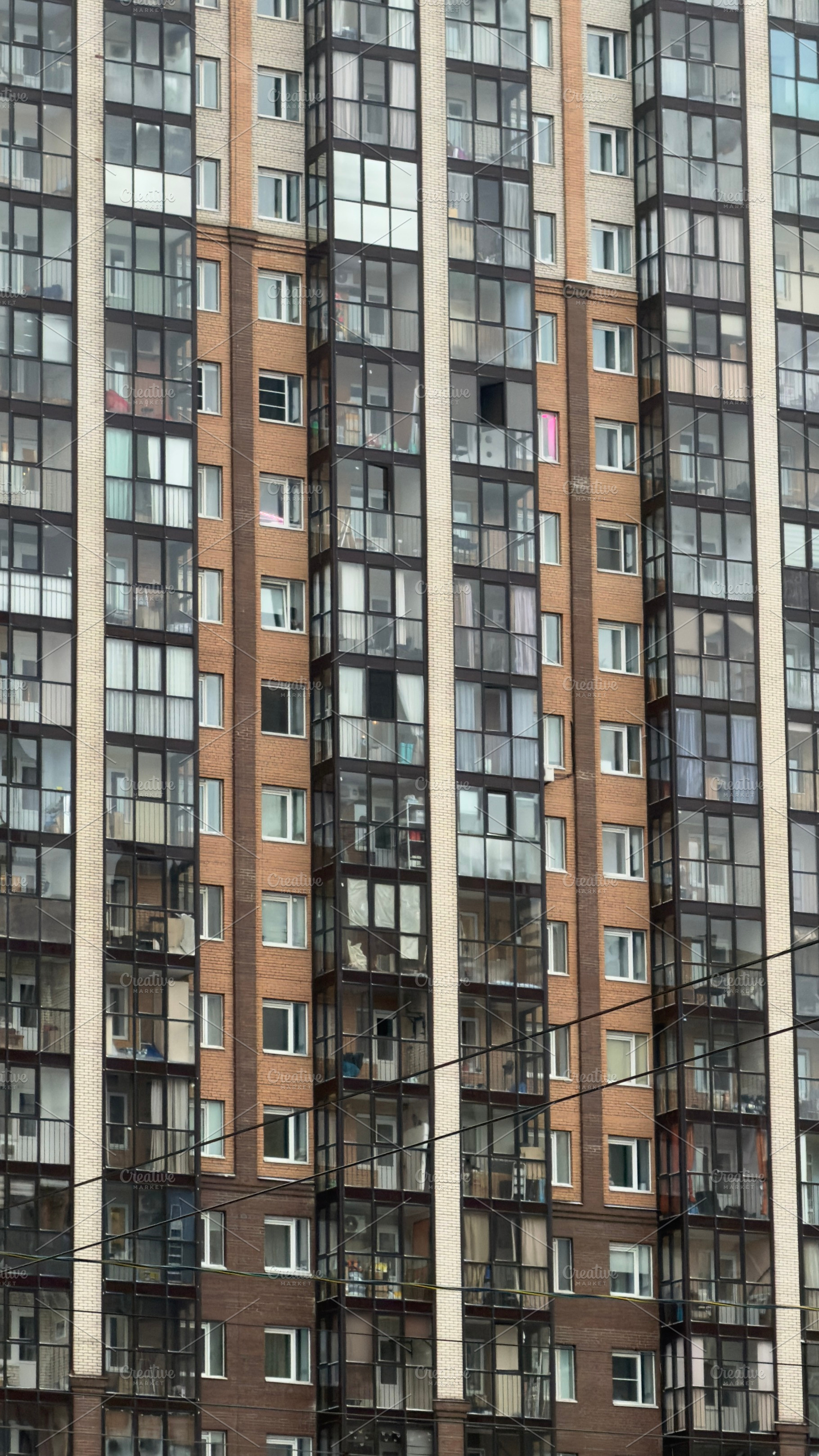 A close-up view of a modern residential building facade, featuring a mix of gla, an Industrial Photo by Textures & Backgrounds