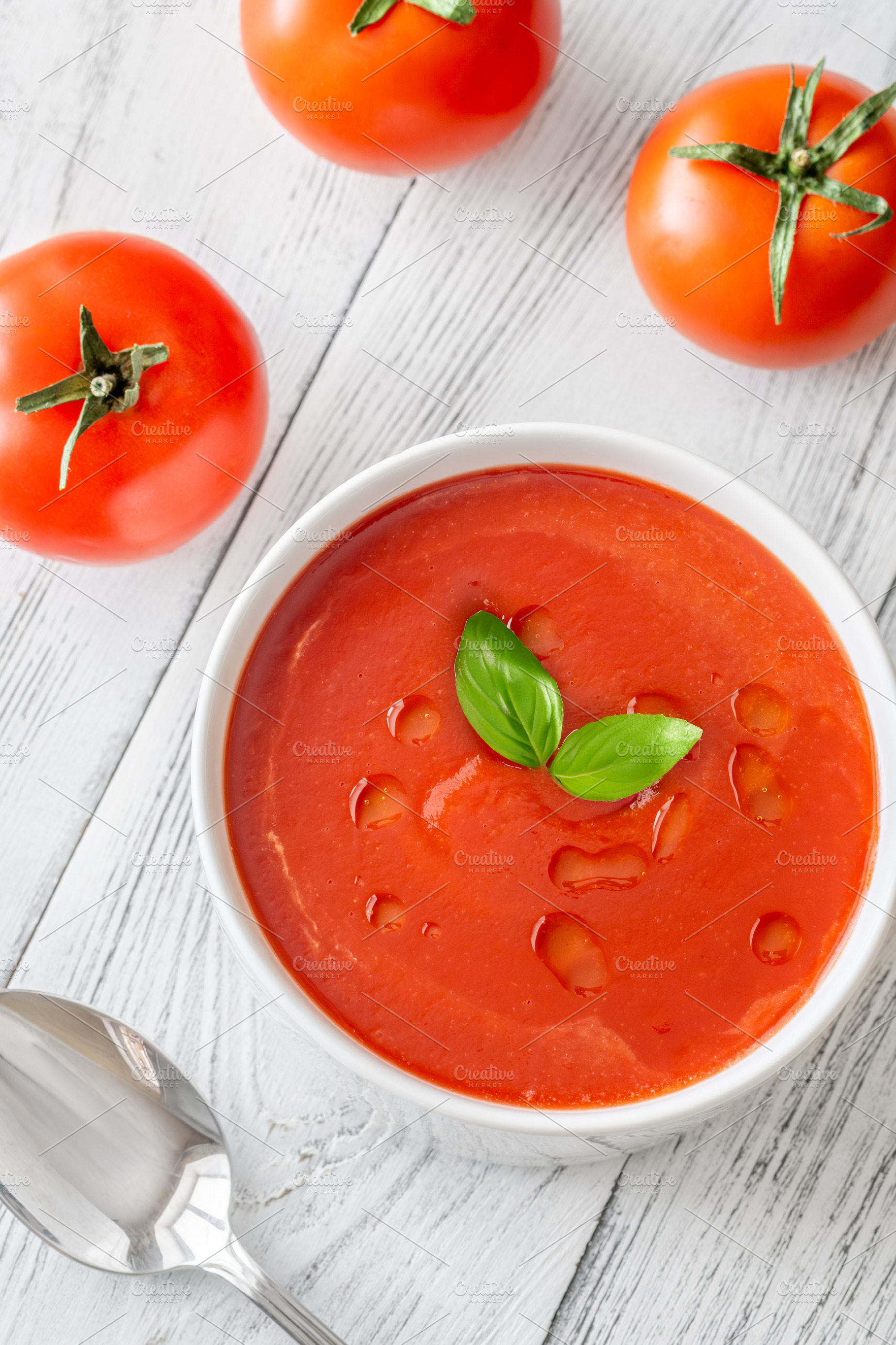 Minimal tomato soup with basil and o, a Food & Drink Photo by Alexander Prokopenko