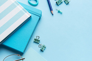 Blue stationery, notebooks, and office supplies organized on a d, a School & Education Photo by Olena Rudo