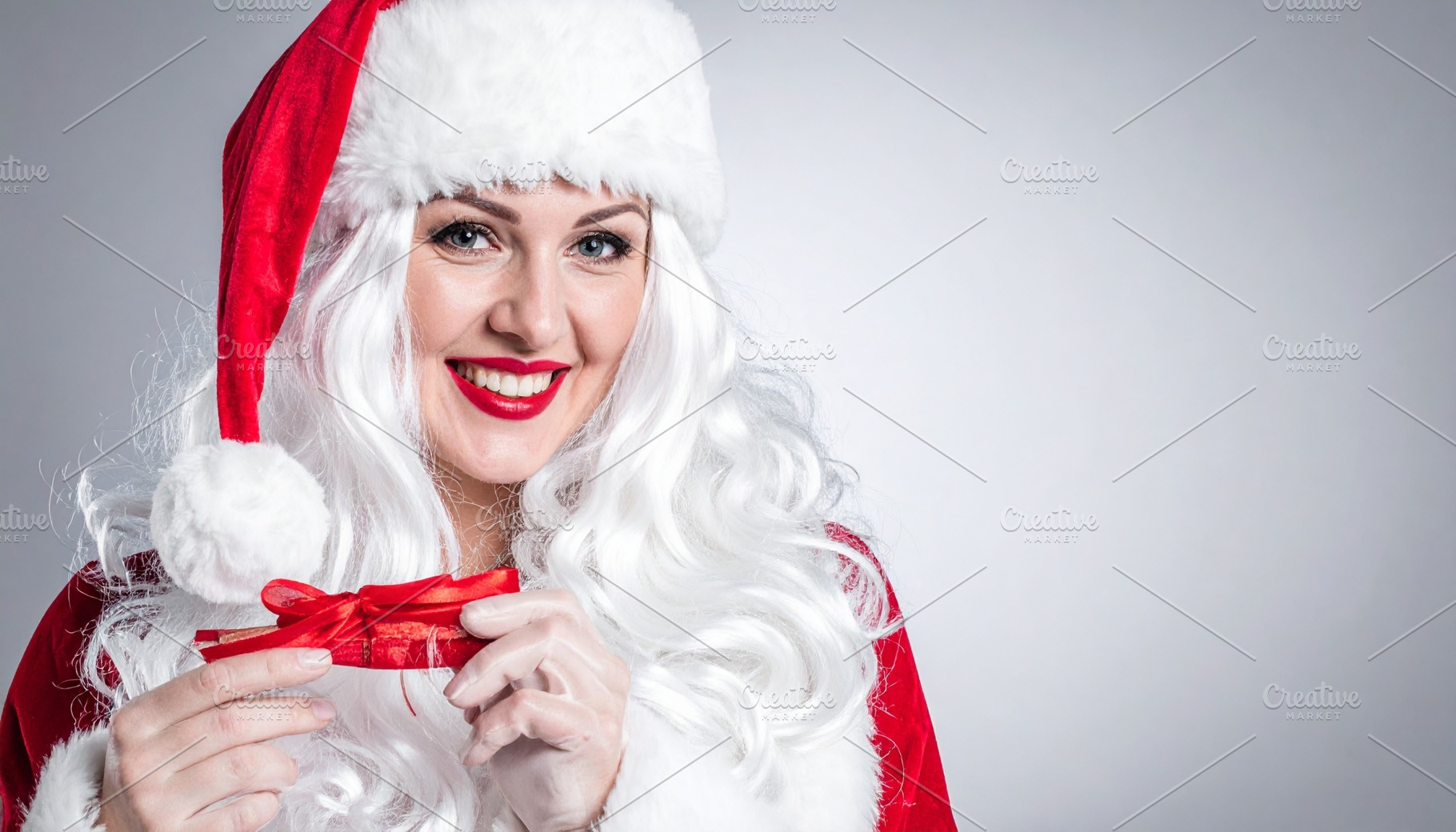 merry christmas card with female santa, a Photo by WorldOfPhotos