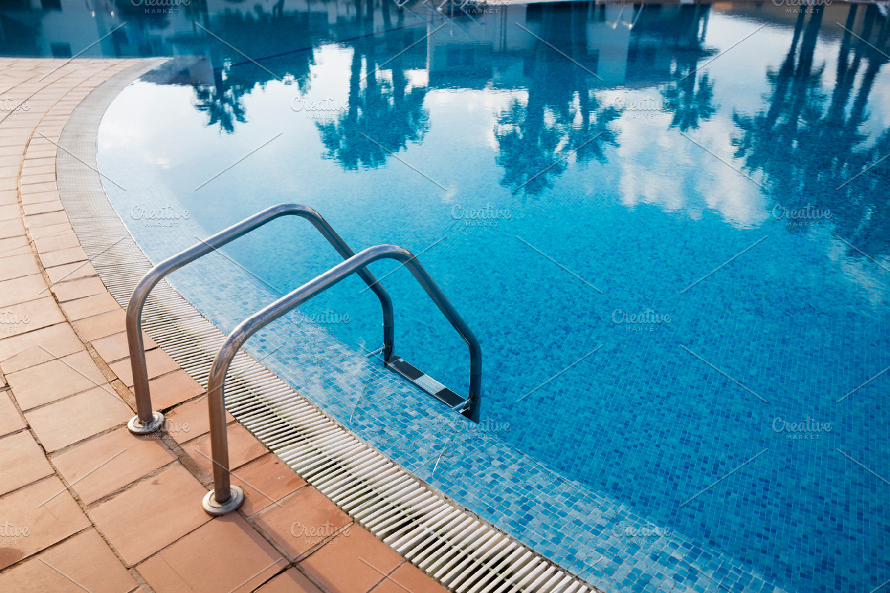 Metal staircase in a pool stock photo containing pool and swimming, a Holiday Photo by Photoweb00