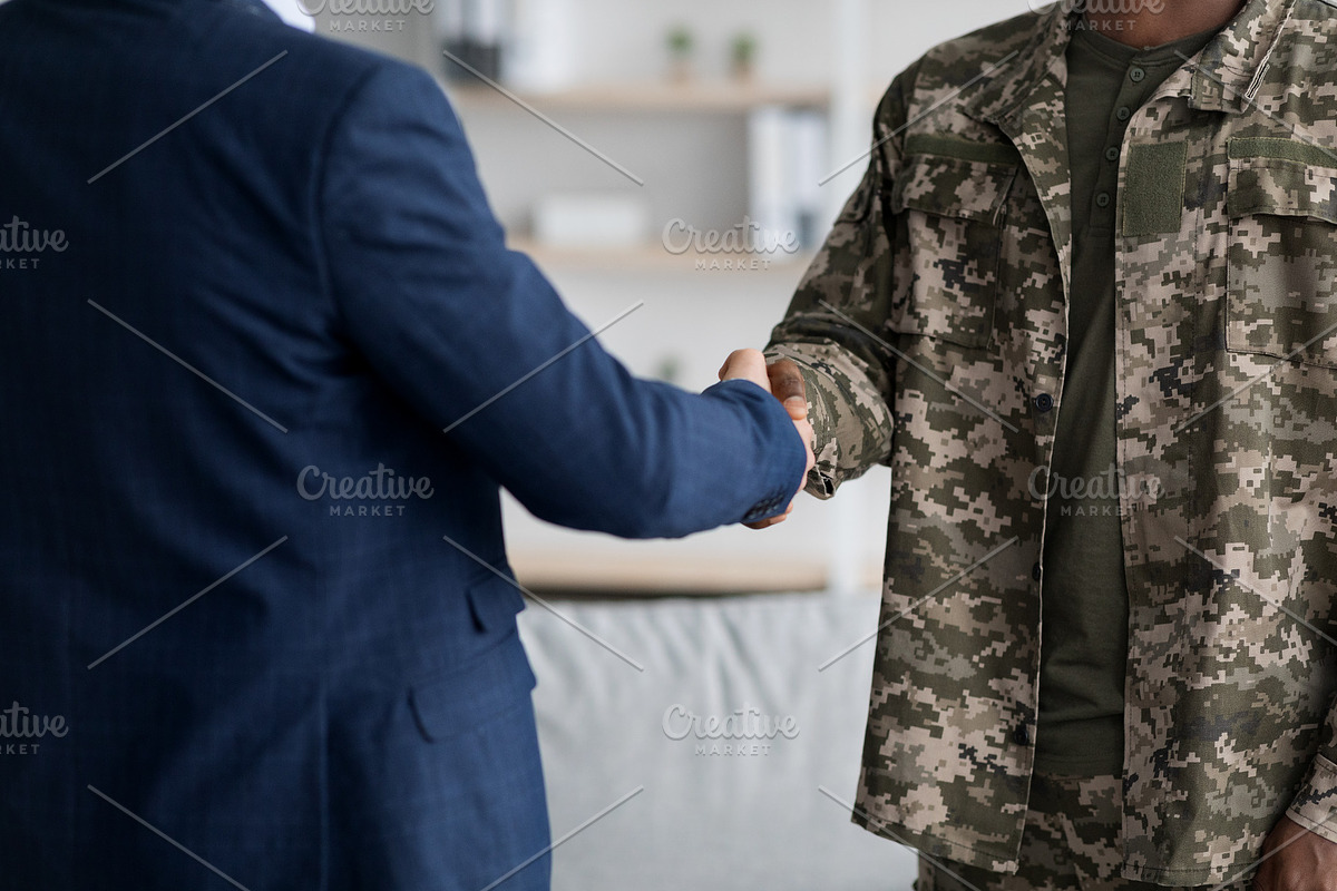 depressed military guy standing next to window, closeup, a Photo by Prostock-Studio (Photo 3 of 3)