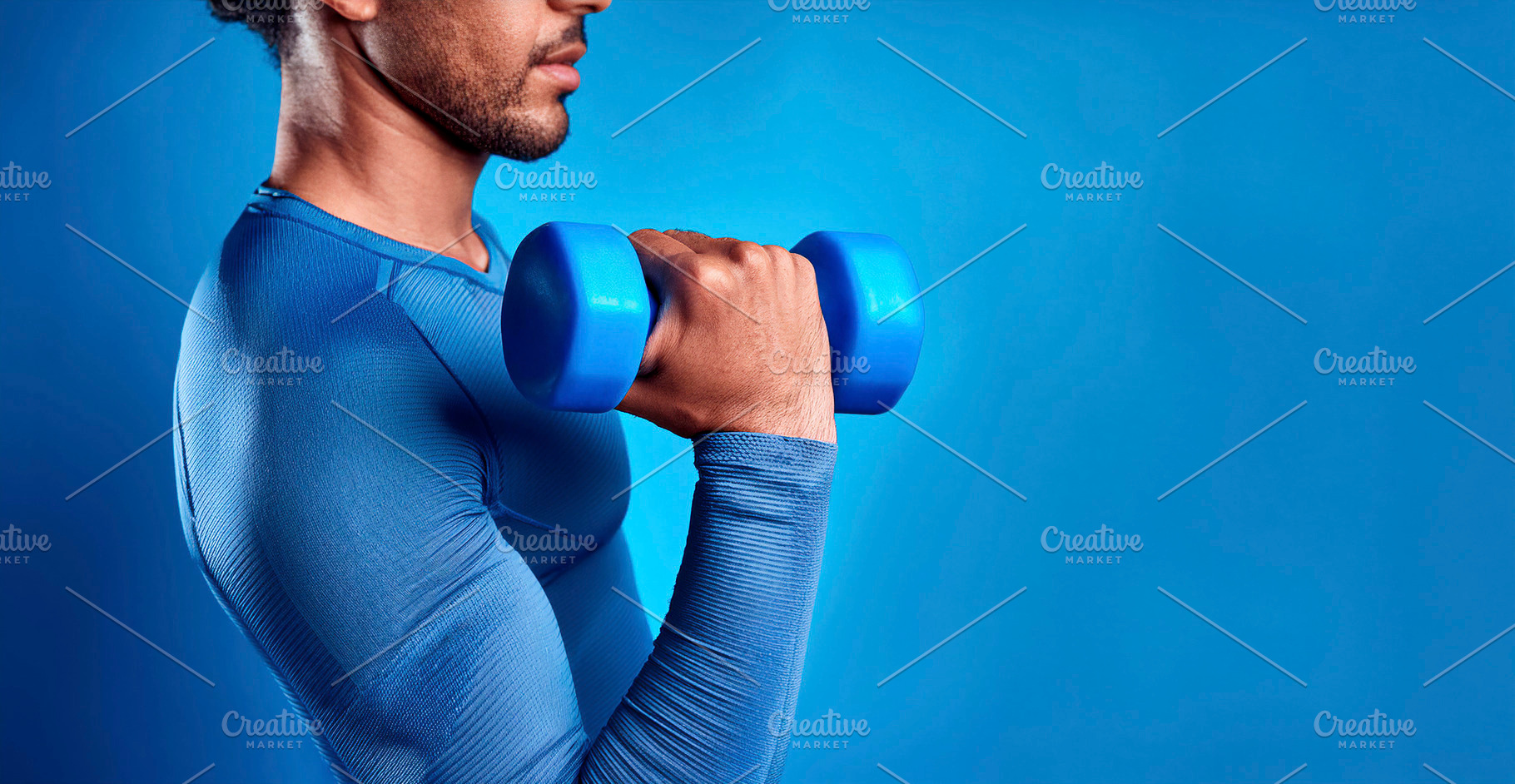 Half body sporty man lifting a dumbbell with blue background, a Sports & Recreation Photo by Davizro's Market