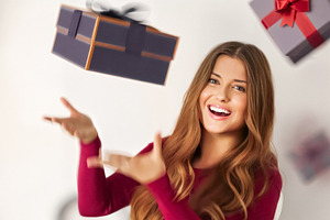 Happy woman catching falling gift boxes, celebrating a birthday,, a Person Photo by Studio ANNA