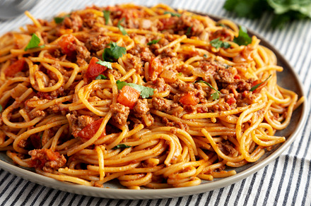 Homemade One-Pot Taco Spaghetti on a Plate, side view., a Food & Drink Photo by LiudmylaChuhunova
