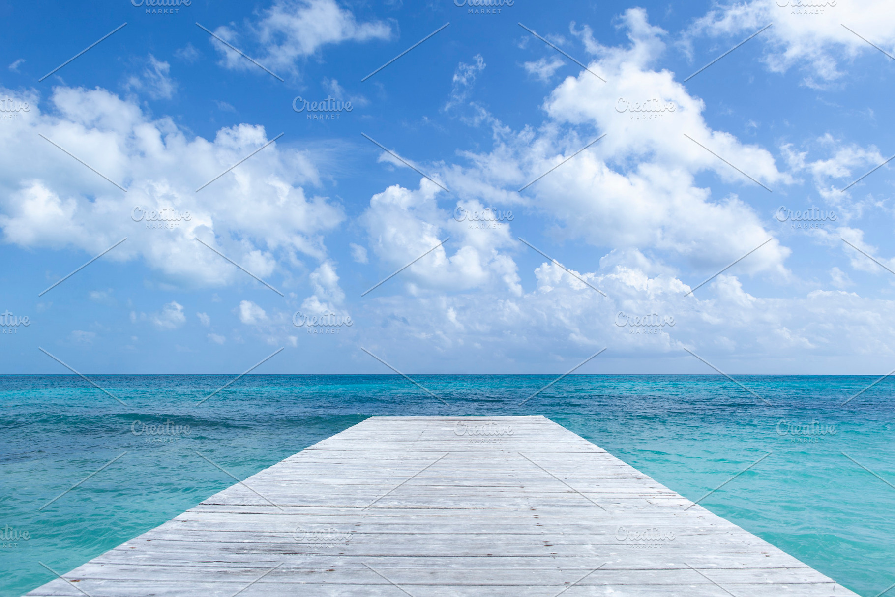 Ocean Pier with a Cloudy Sky, a Holiday Photo by Mint Pixels