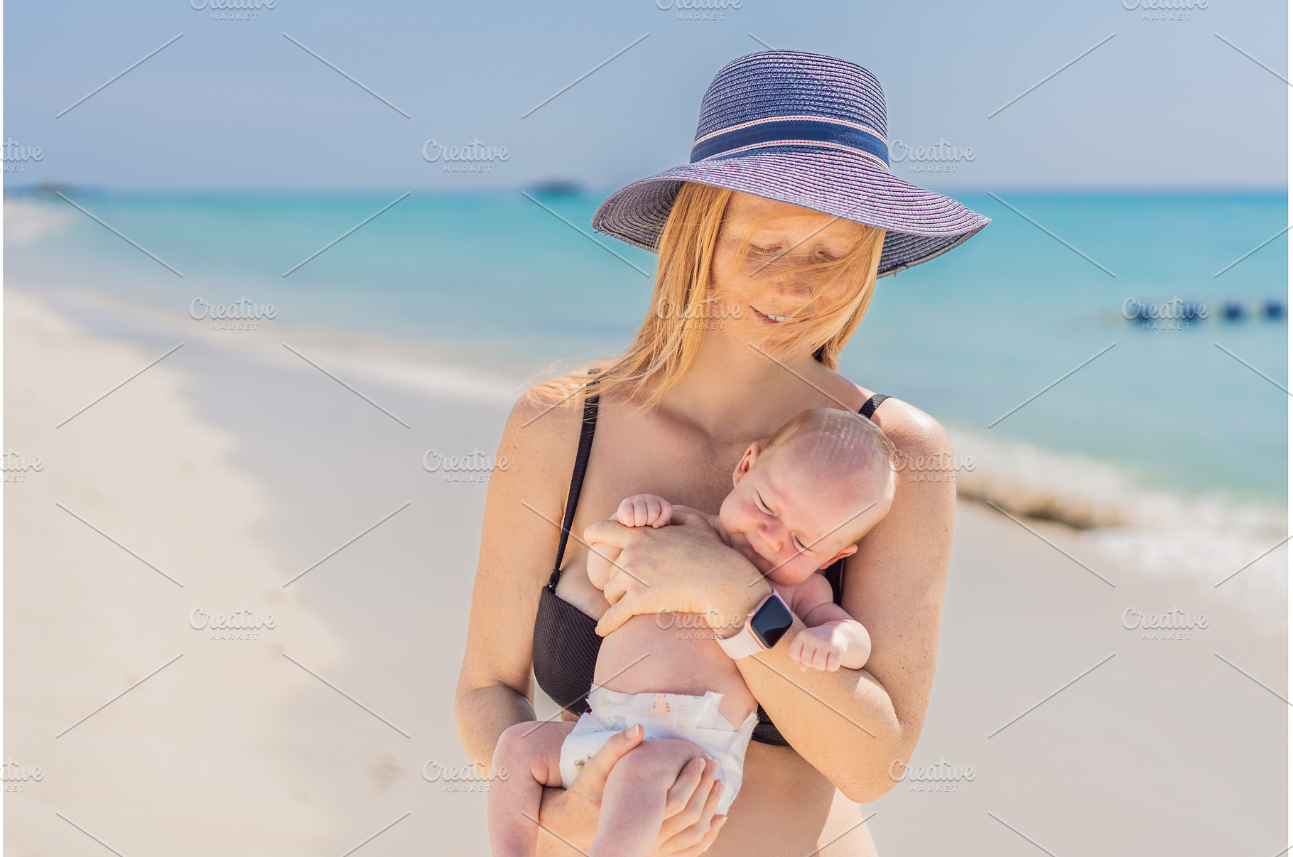 Mother holding her newborn baby by, a Person Photo by Elizaveta Galitskaya