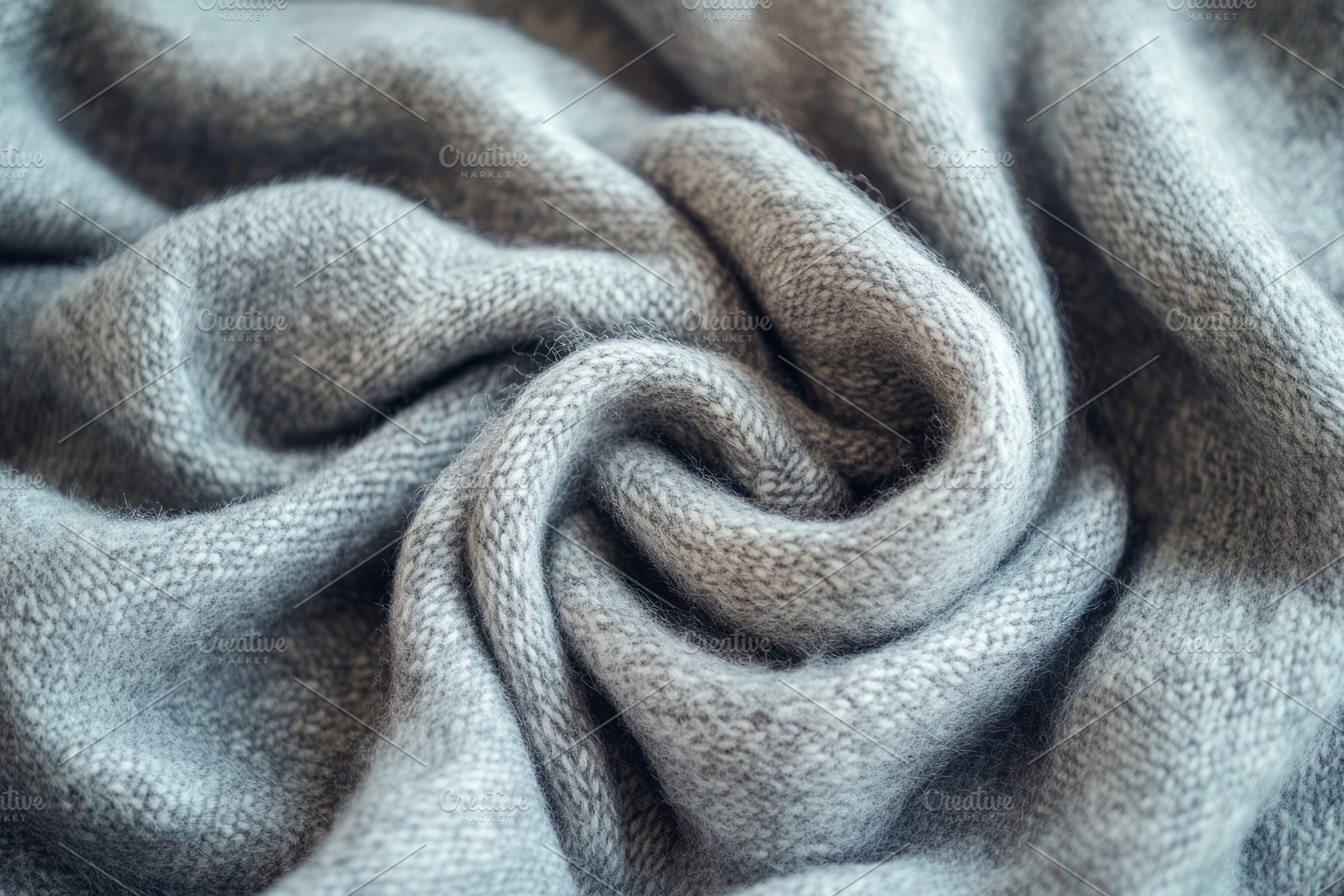 A close-up of a soft, gray knitted fabric showcasing intricate textures and fol, a Background Photo by ImageMir