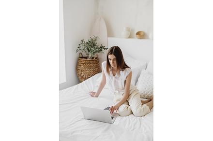 Beautiful woman working on laptop, a Person Photo by Aliona Serzhanova
