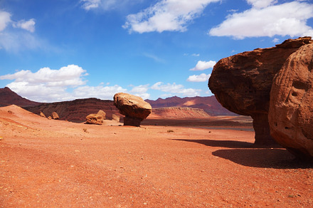 Giant stone in the red desert, a Background Photo by kavram