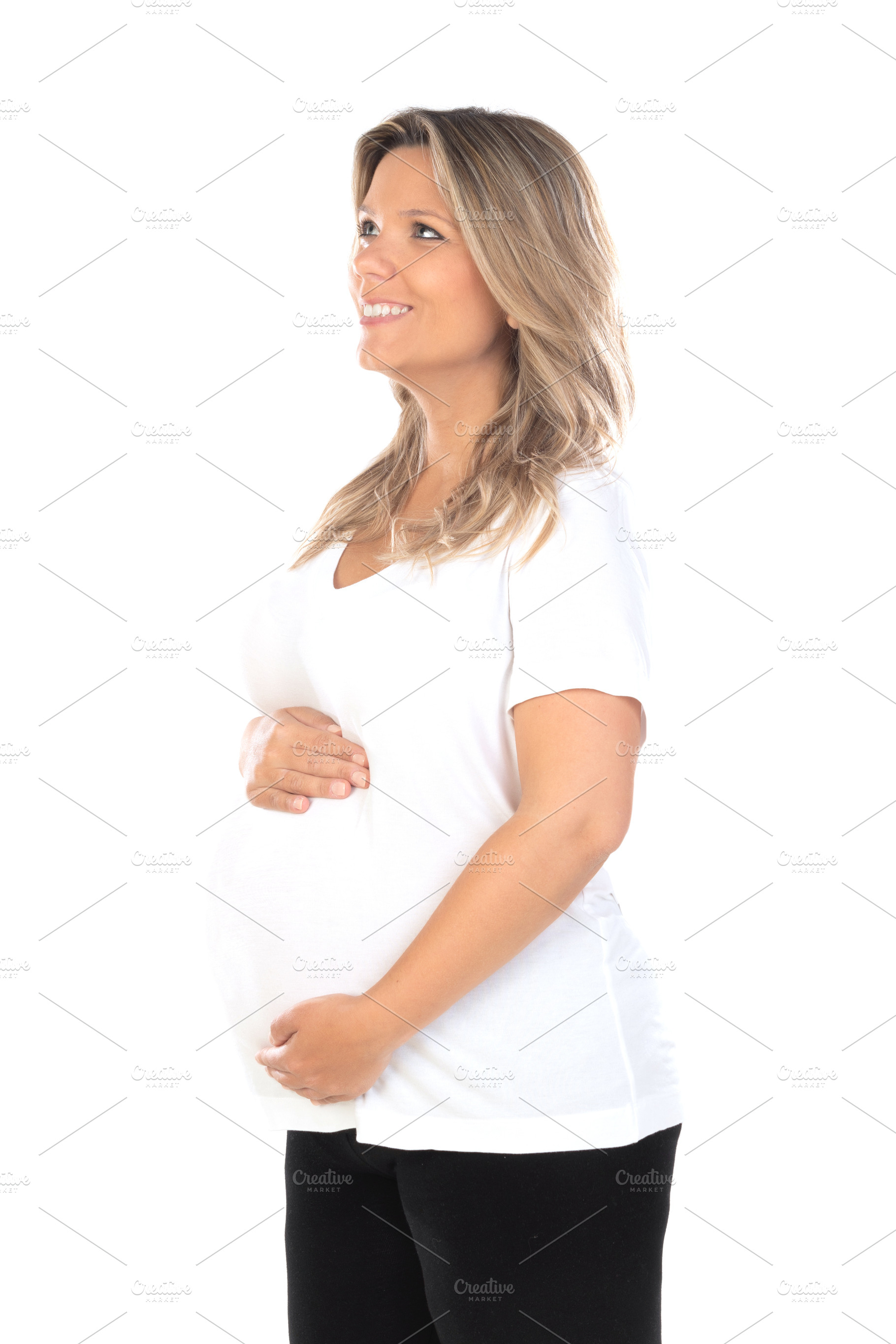 Young beautiful blonde woman pregnant expecting baby over isolat, a Person Photo by José Manuel Gelpi