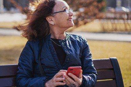 Mature woman with smartphone, a Person Photo by Olezzo